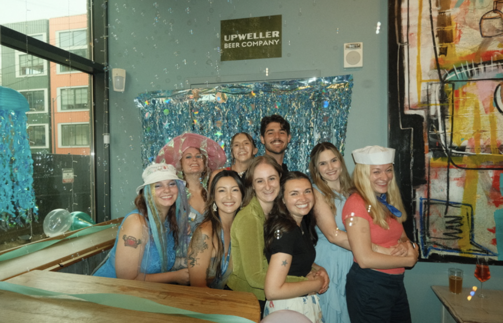 A group of Knauss Fellows on the prom committee smile for the camera.